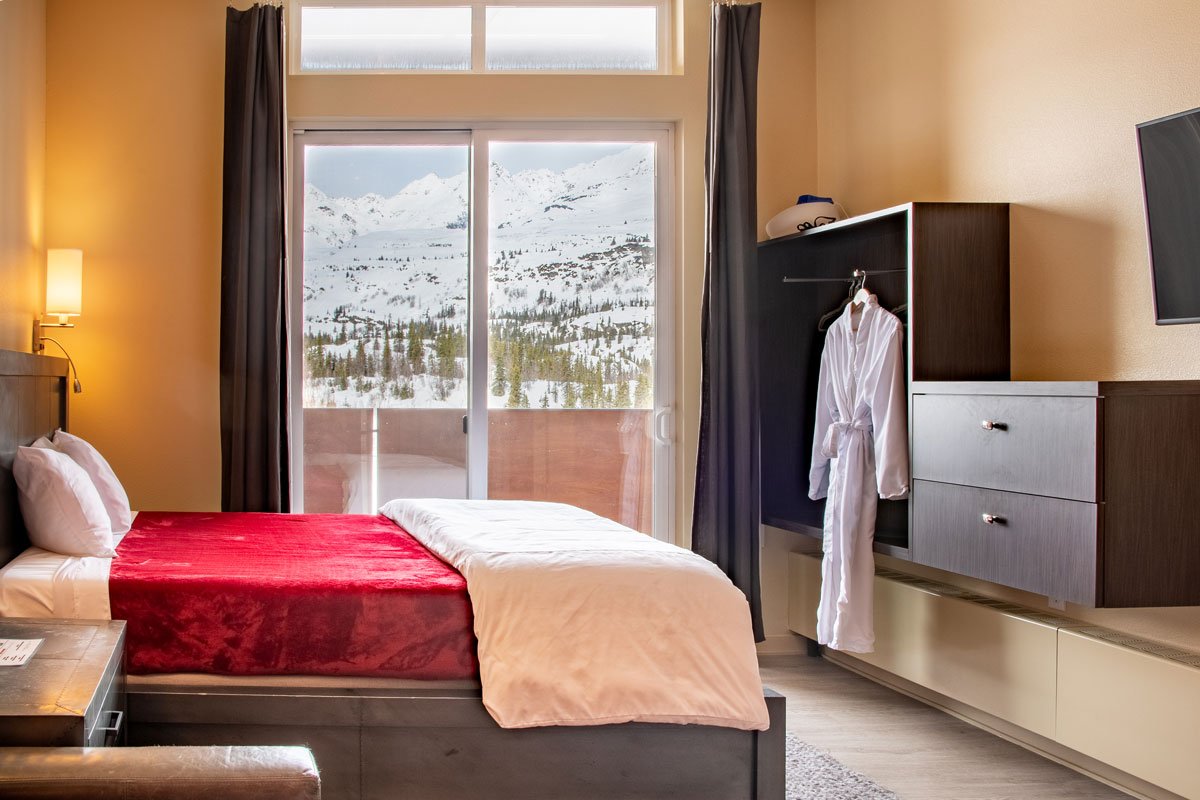 Private suite with a Tempur-Pedic queen bed at the Tsaina Lodge