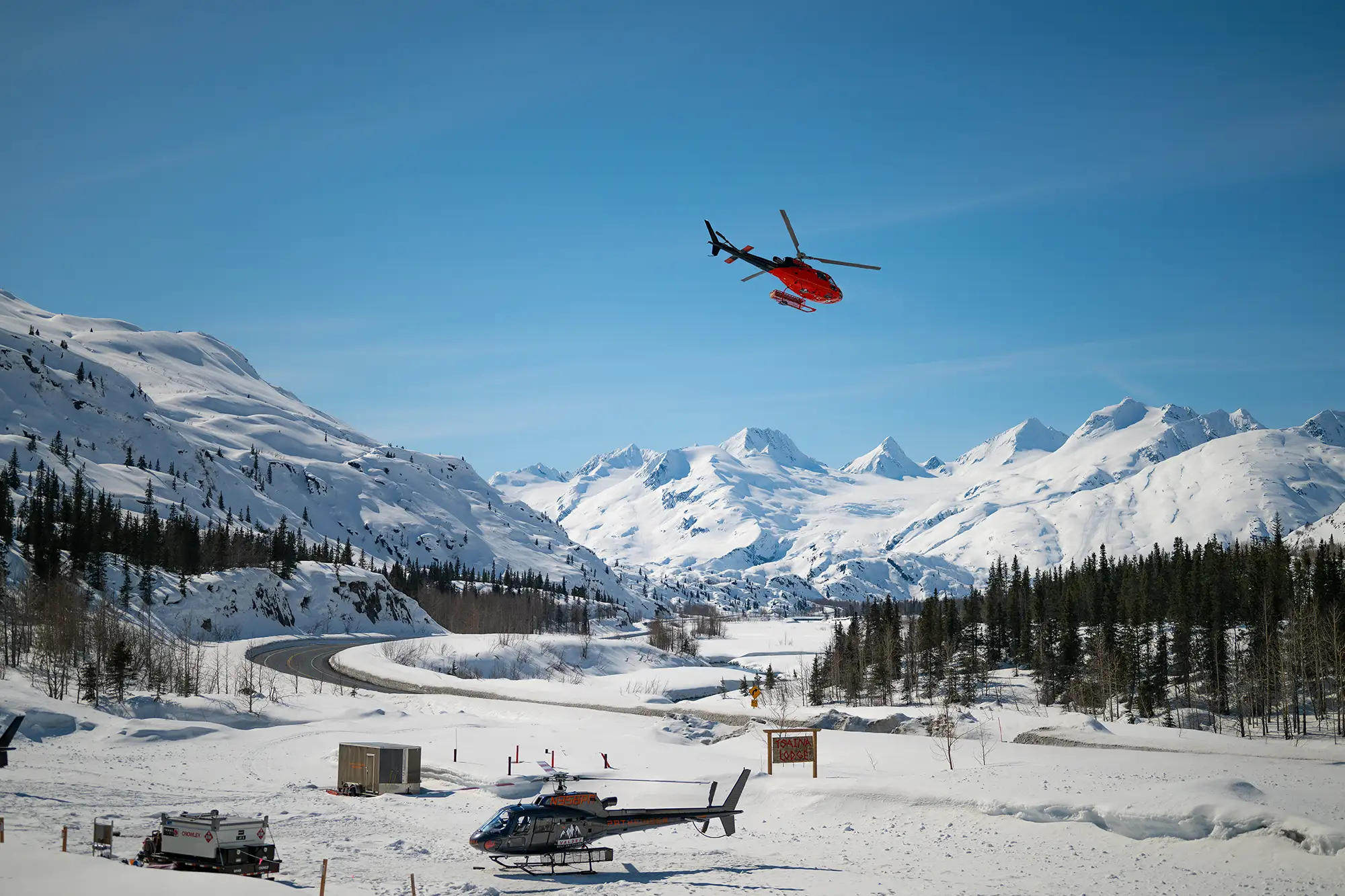 A helicopter on the heli-pad beside the Tsaina Lodge, ready for a day in the Chugach, Alaska