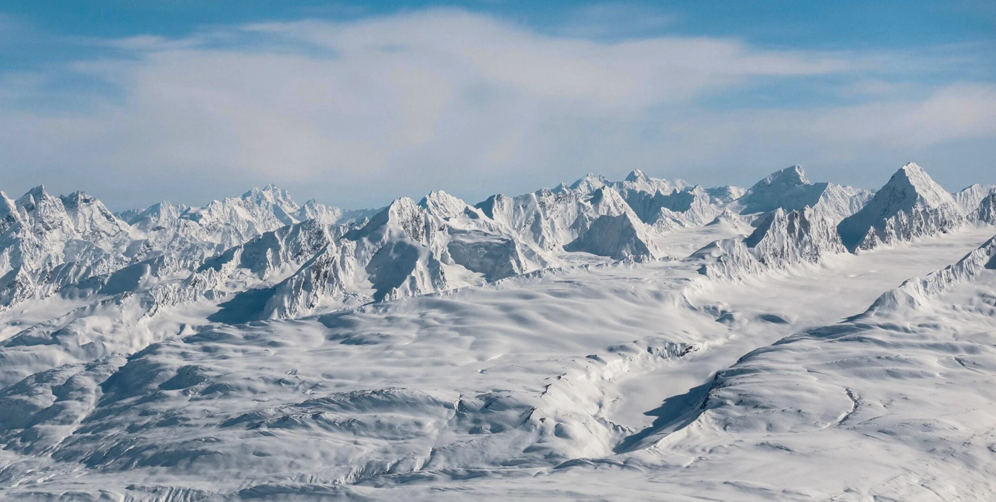 Snow-loaded spine walls in the Chugach Mountains near Valdez, Alaska - maritime snowpack clinging to 50-degree faces